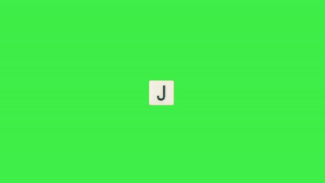 letter j scrabble slide from left to right side on green screen, letter j green background