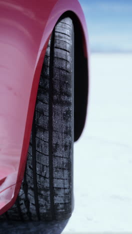 close-up of a car tire in the snow