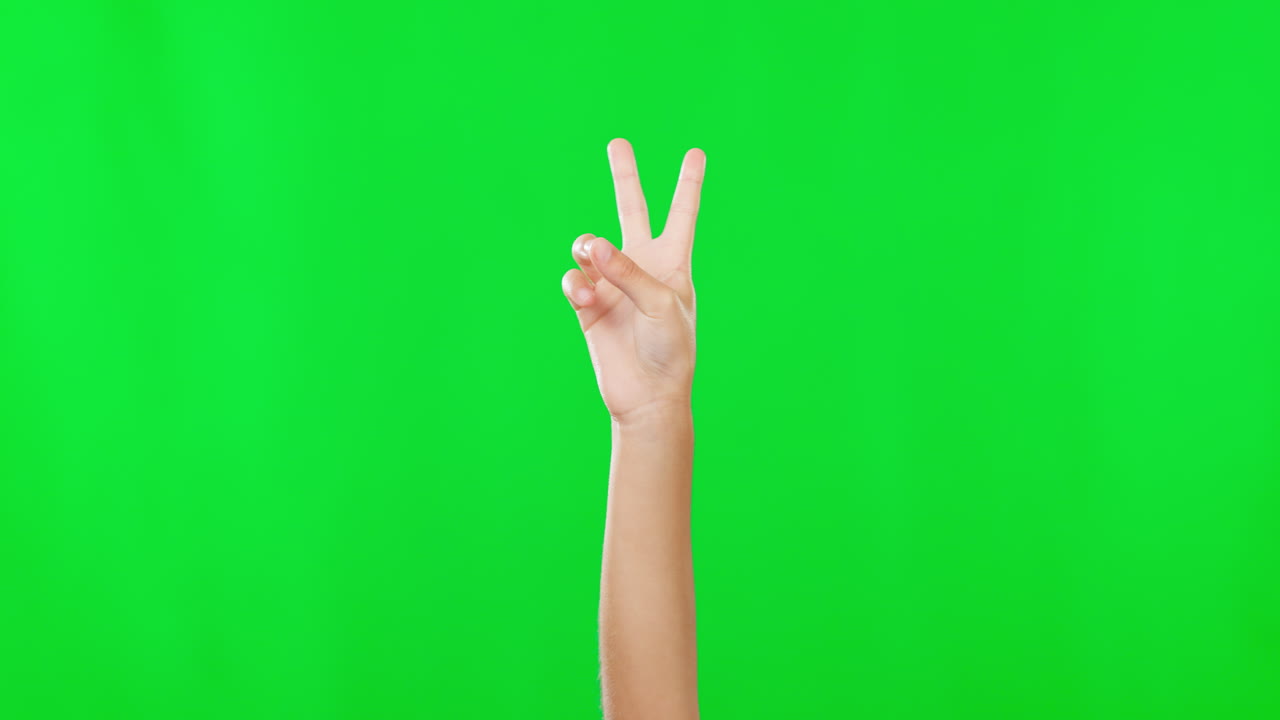 Hands, green screen and closeup of a peace sign