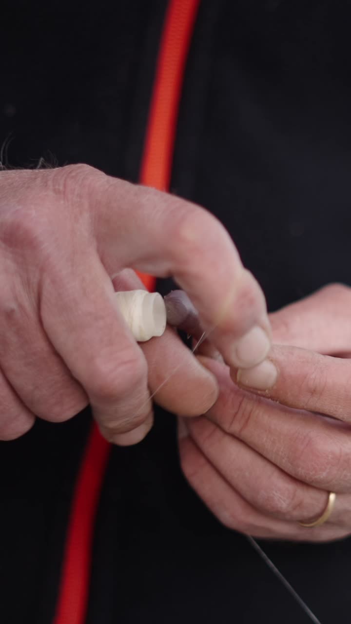 Tying a fishing knot