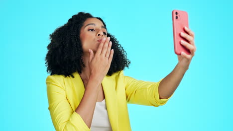 Peace-sign,-kiss-and-selfie-of-woman-in-studio