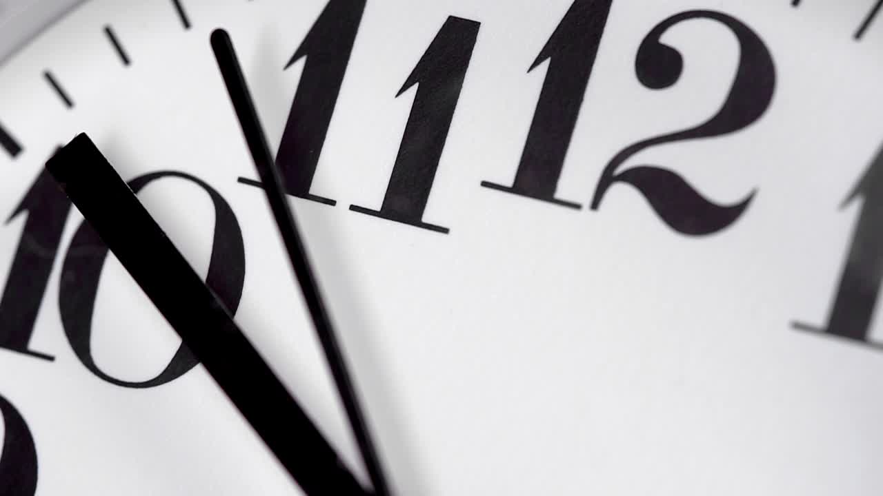 Wooden round clock. Close-up view.