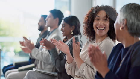 group of business people applauding at a conference