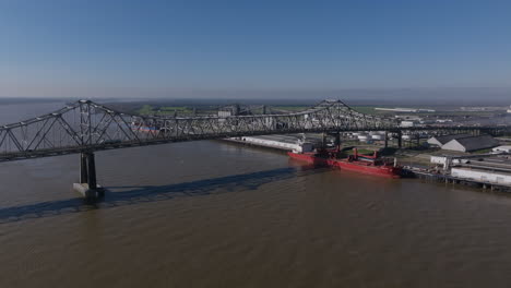 Wide-aerial-footage-rotating-around-Horace-Wilkinson-Bridge-with-during-the-morning-with-traffic-moving-across-the-bridge