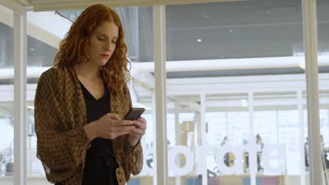 businesswoman using mobile phone in office 4k