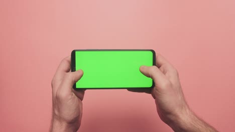 gestos de juego en el teléfono de pantalla verde