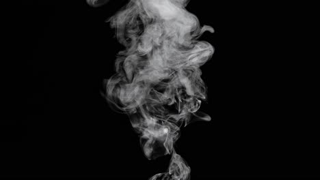 smoke spraying up on black background