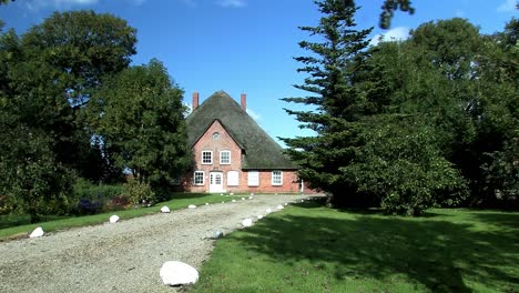 Traditional-north-German-house-with-thatched-rooves-near-town-of-Husum,-Germany-3