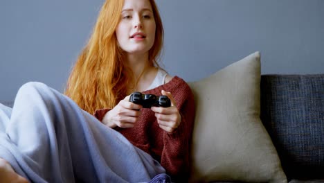 Woman-playing-video-games-in-living-room-4k