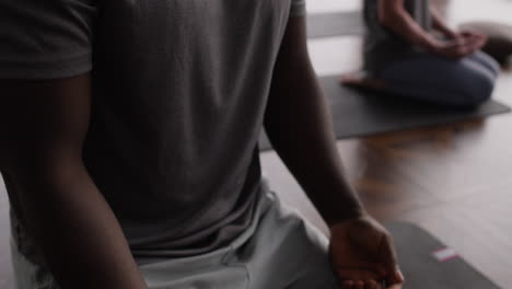 couple meditating in a yoga studio