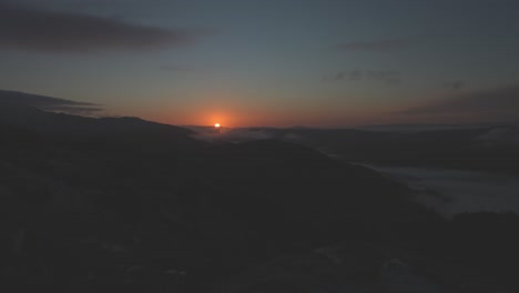 Slow-sunrise-shot-from-behind-Scottish-Munros-in-the-highlands