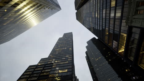 skyscrapers rise against a cloudy sky in an urban landscape during twilight