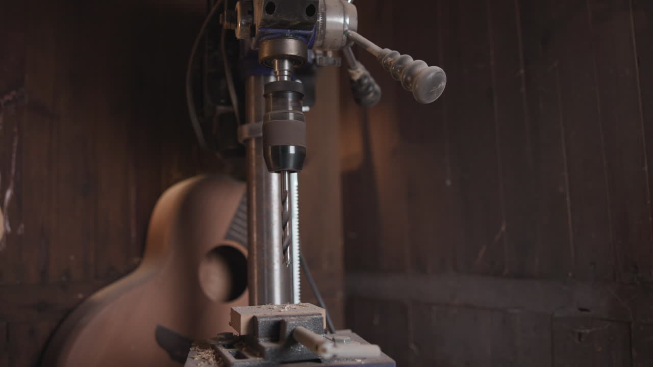 Drill press and guitar in workshop