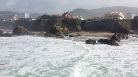 aerial drone view of the beach of bakio in the basque country in a foggy day