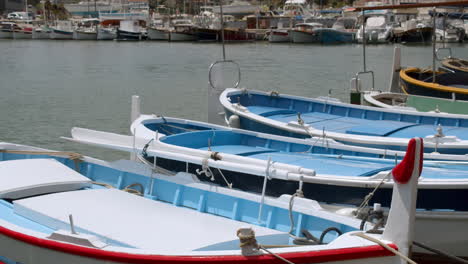 Colourful-boats-moored-in-a-dock-bobbing-around-with-light-movement