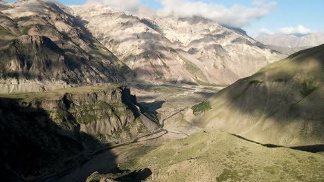 aerial view of a pan in the arid mountains of the central zone in the maule region of chile on a sunny day