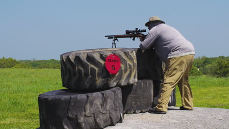 man with rifle at the firing point during precision rifle match in leach, oklahoma