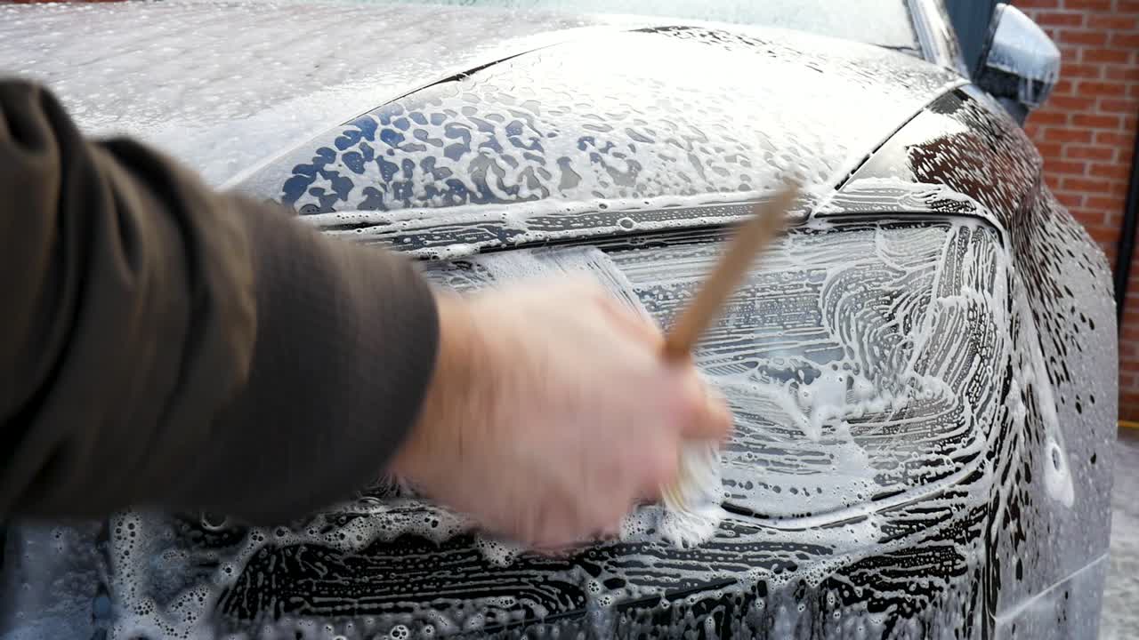 Cleaning Car Headlight With a Detailing Brush