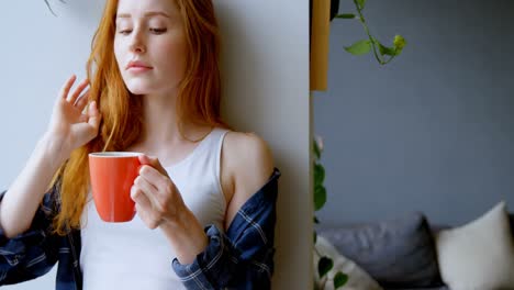 Woman-having-coffee-at-home-4k