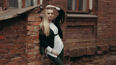 beautiful woman in urban background with copyspace. young woman posing outdoors