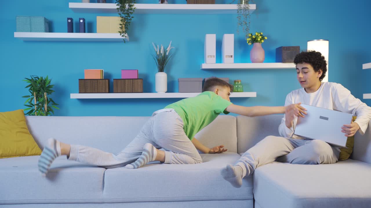 The older brother who took his younger brother's laptop from him.