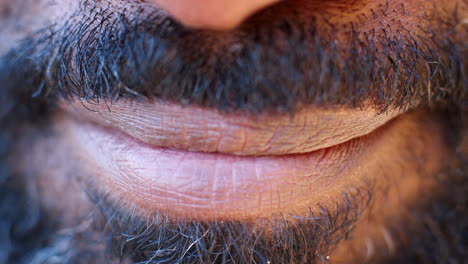 close up of the mouth of a smiling black man