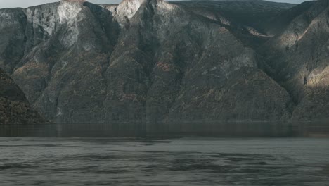 Fjord-in-Western-Norway-with-beautiful-mountains-in-the-background-and-strong-current-in-the-foreground