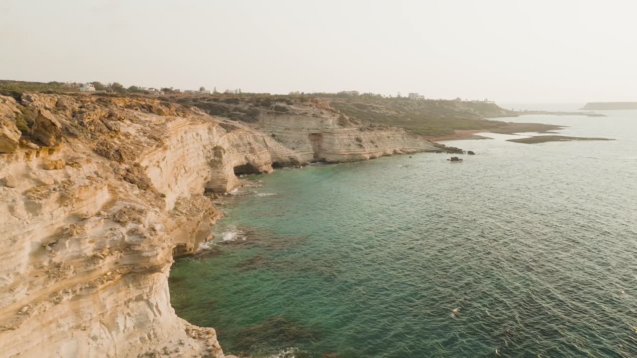 Stunning Aerial View of Coastal Cliffs and Turquoise Sea