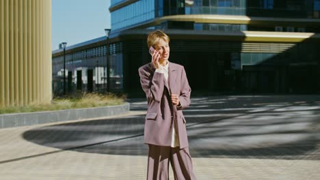 businesswoman talking on phone in city