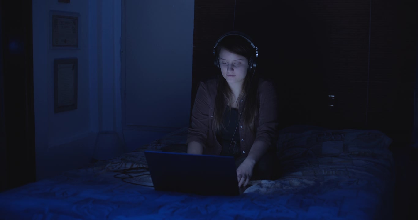 Woman enjoying music video at night