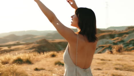 woman in nature dancing with bubbles