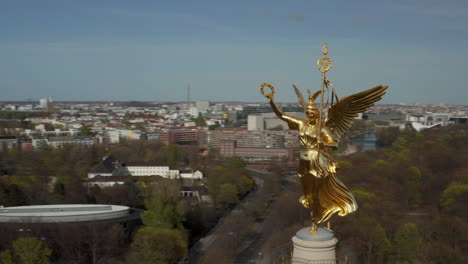 AERIAL:-Close-Up-Circling-around-Berlin-Victory-Column-Golden-Statue-Victoria-in-Beautiful-Sunlight