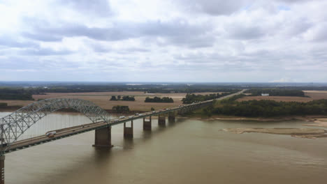 An-aerial-shot-of-the-Hernando-de-Soto-Bridge,-Interstate-40,-the-Mississippi-River,-West-Memphis,-Arkansas,-and-Memphis,-Tennessee