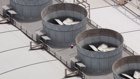 cooling tower fans spinning on a rooftop in dubai