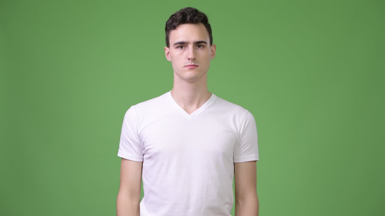 Young handsome man covering mouth as three wise monkeys concept