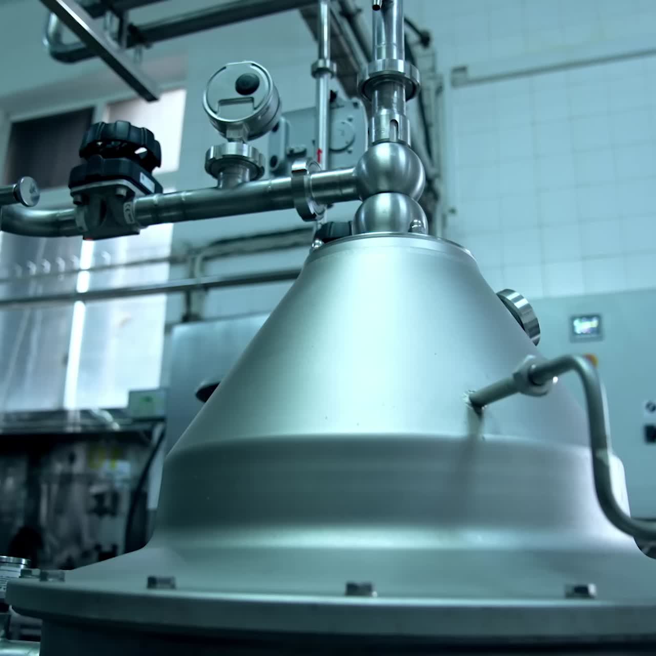 New technological milk factory with steel tubes. Diary food industry milk manufacturing. Close look at the pipelines