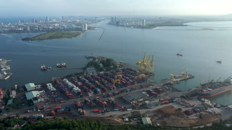 a shipping port with containers and cranes in vietnam