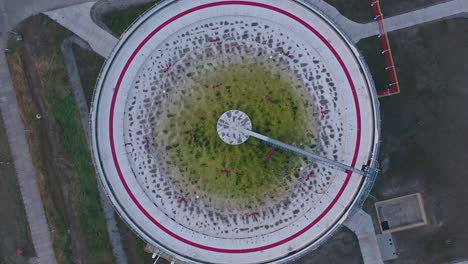 aerial view of wastewater, sewage clarifier and skimmer - wastewater treatment facility