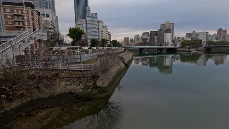 time-lapse of a cityscape reflected in calm water