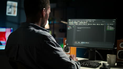 black man programmer manages code and scripts in artificial intelligence