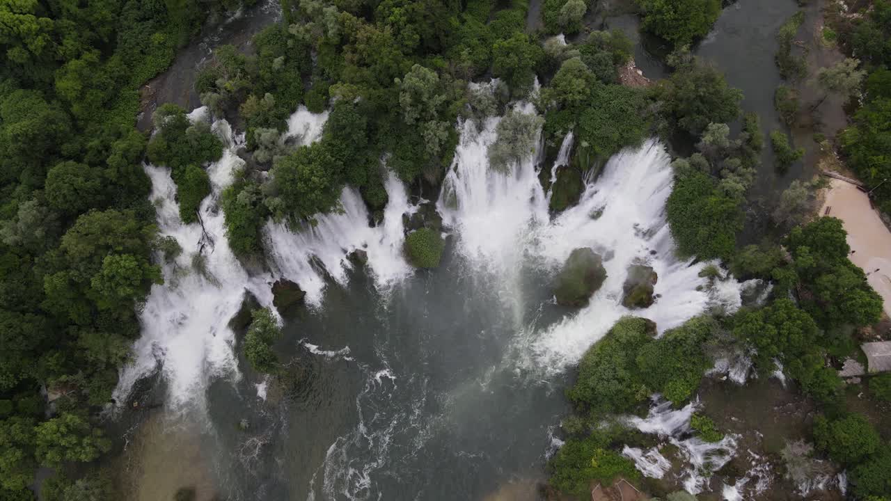 Full summer landscape drone view of Bosnia's Kavica waterfall, a mountain landscape with many water streams