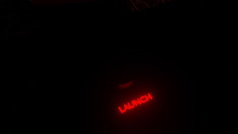 botón de lanzamiento rojo en interfaz futurista oscura