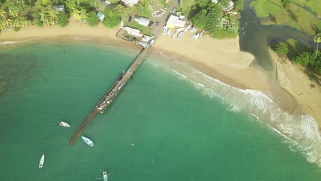 drone view of parlatuvier beach and jetty in the fishing village of the caribbean island of tobago