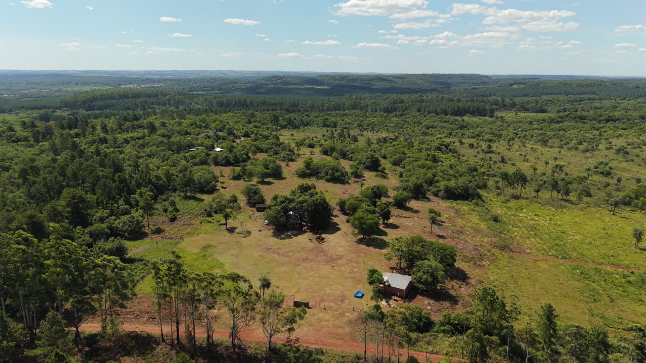 Aerial Landscape of Verdant Countryside with Scattered Rural Homes. Eco-Tourism Concept.