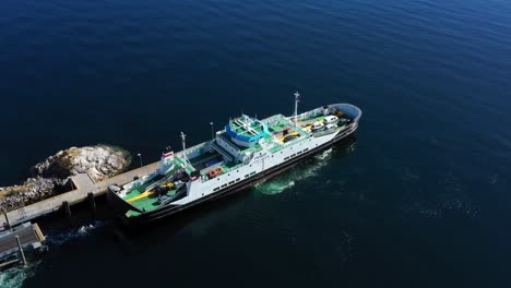 the car ferry departs from the quay at solholmen ferry quay on the island of midsund