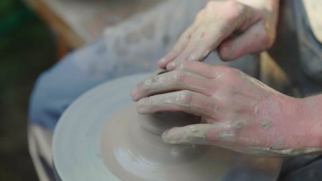 the hands of the master potter makes a pot of clay traditional crafts 4k slow motion video