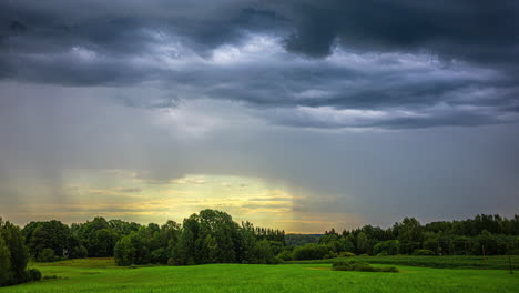 majestic stratonimbus clouds and falling rain in medium wide shot with backlit sunlight