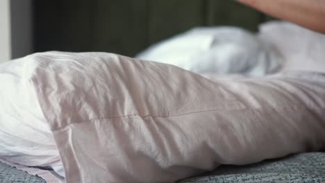 close-up of a white pillow on a bed