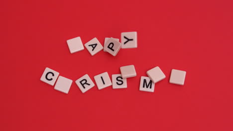 Letter-tiles-moving-to-spell-out-happy-christmas-on-red-background