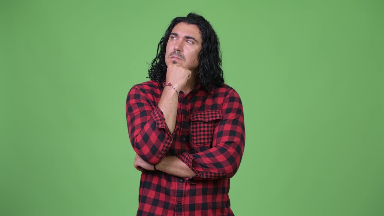 Happy handsome hipster man thinking